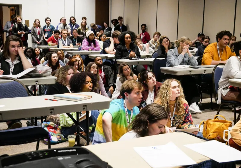 A room full of Convention attendees at a workshop