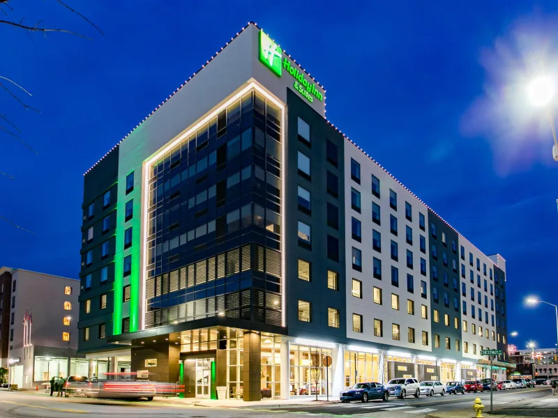 Exterior photo of Holiday Inn and Suites at night